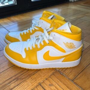 Nike mid air Jordans university gold sneakers.